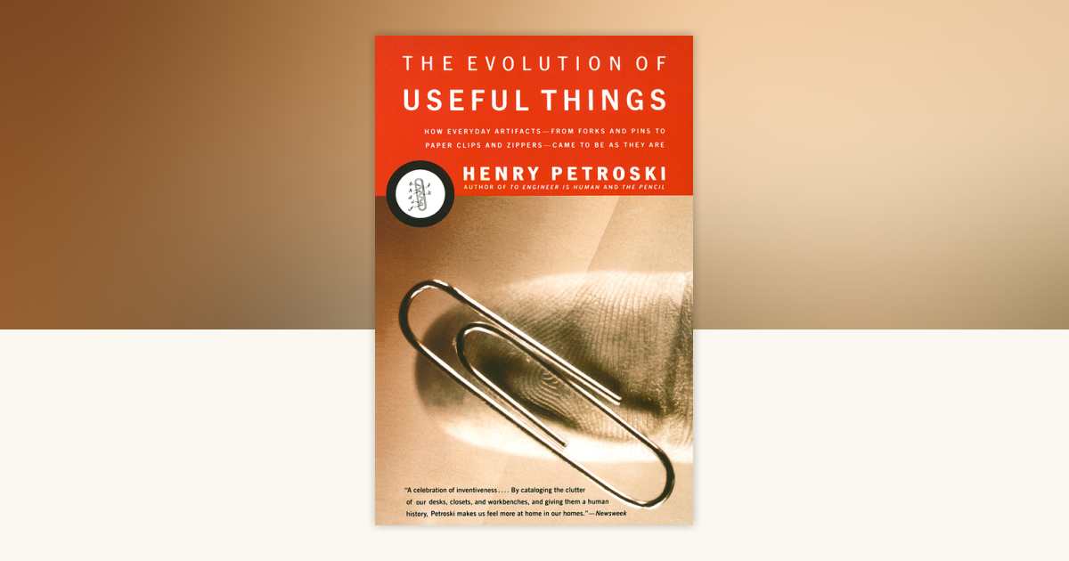 Cover for the book The Evolution of Useful Things bu Henry Petroski, showing an extreme closeup of a paperclip resting on a fingertip.